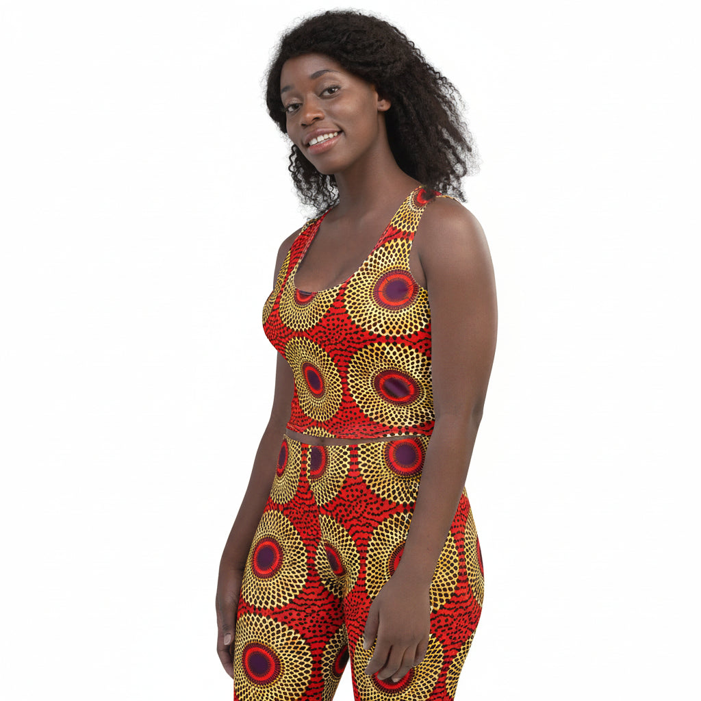 Woman wearing a yellow leopard print top and blue jeans on a white background