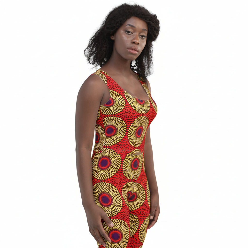 A woman modeling a sleeveless African Print Women's Crop Top: Rekiana Sunburst High-Performance Stretch Tank, shown against a plain white background.