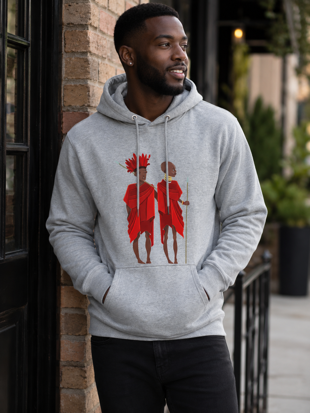 Man wearing a gray Agojie Unisex Lightweight Hoodie | ASAKE-OGE, standing outdoors.