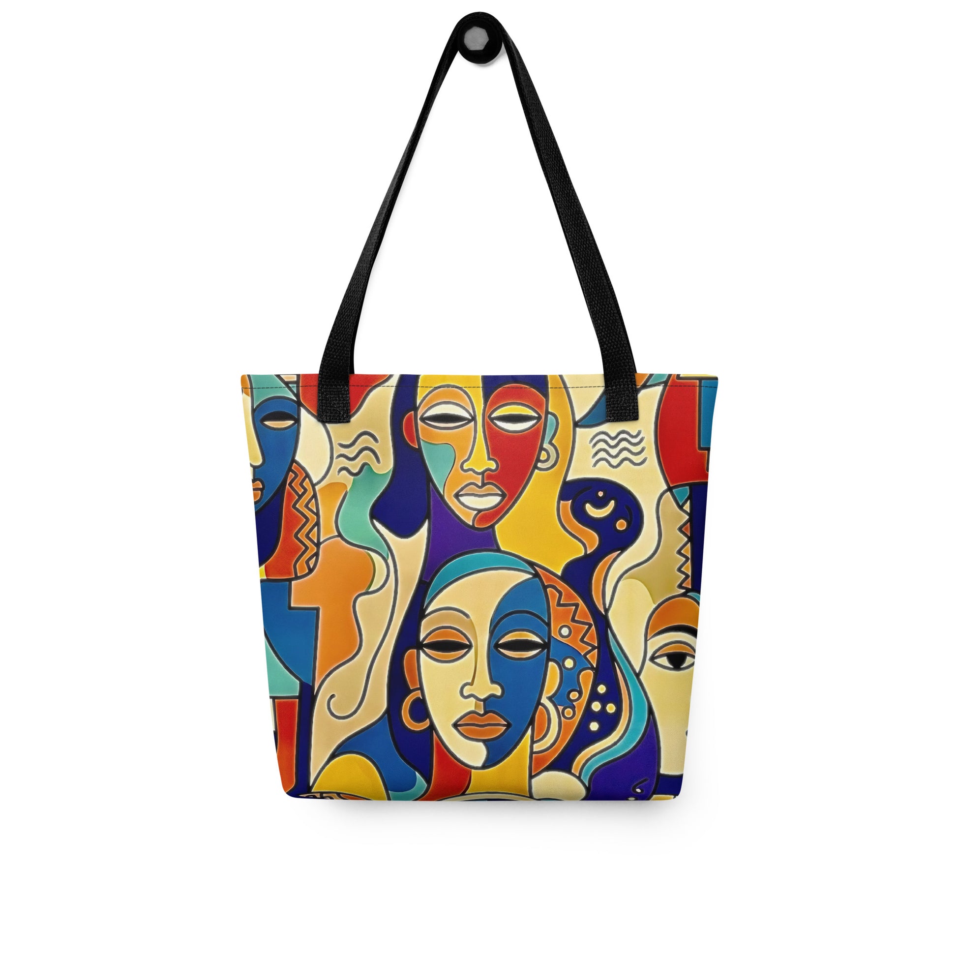 Colorful Asake oge tote bag with abstract face design on a white background