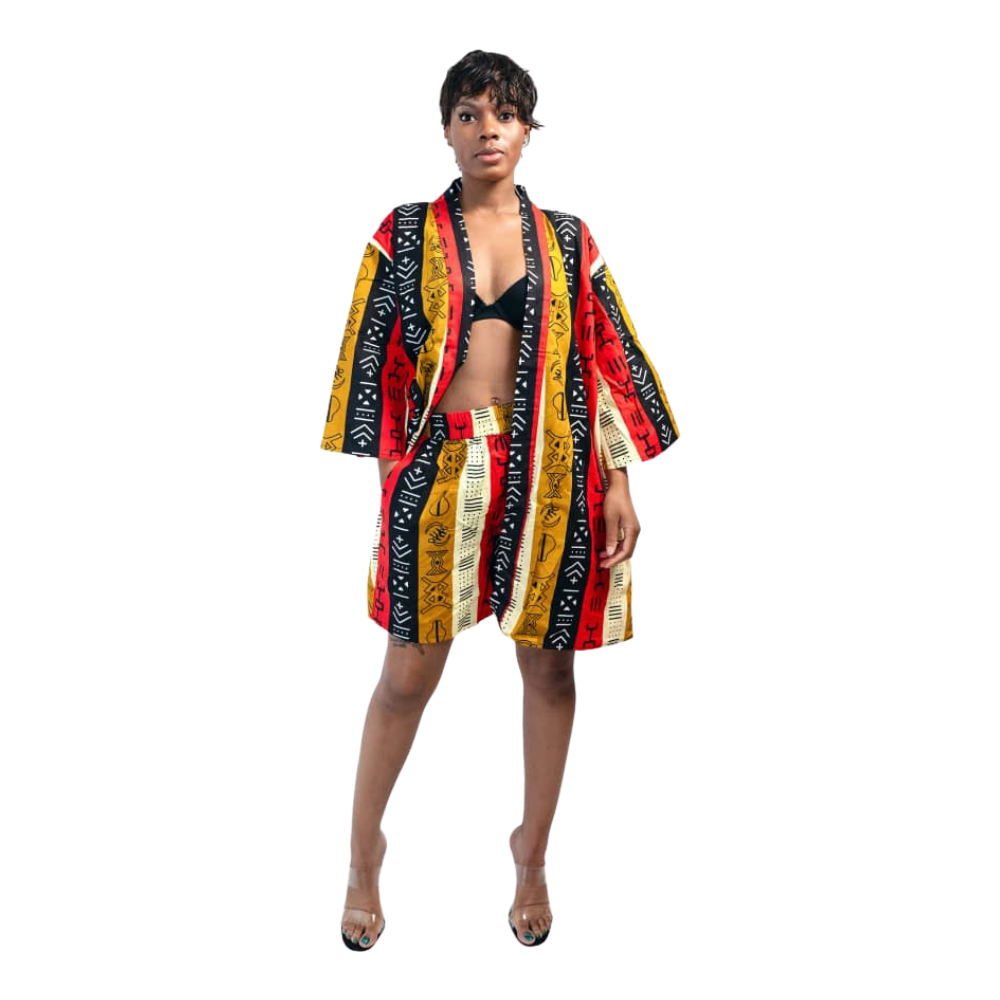 Woman wearing a colorful patterned robe on a white background