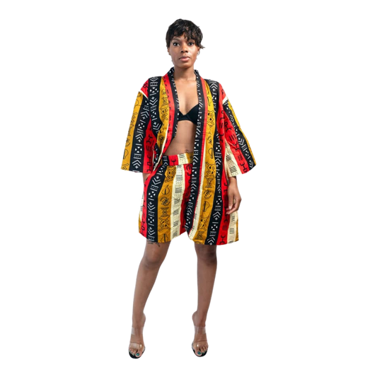 Woman wearing a colorful patterned robe on a white background