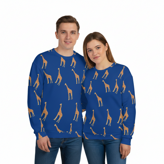A man and a woman standing side by side wearing matching royal blue crewneck sweatshirts with an all-over tan giraffe print, paired with blue jeans, against a plain white background.