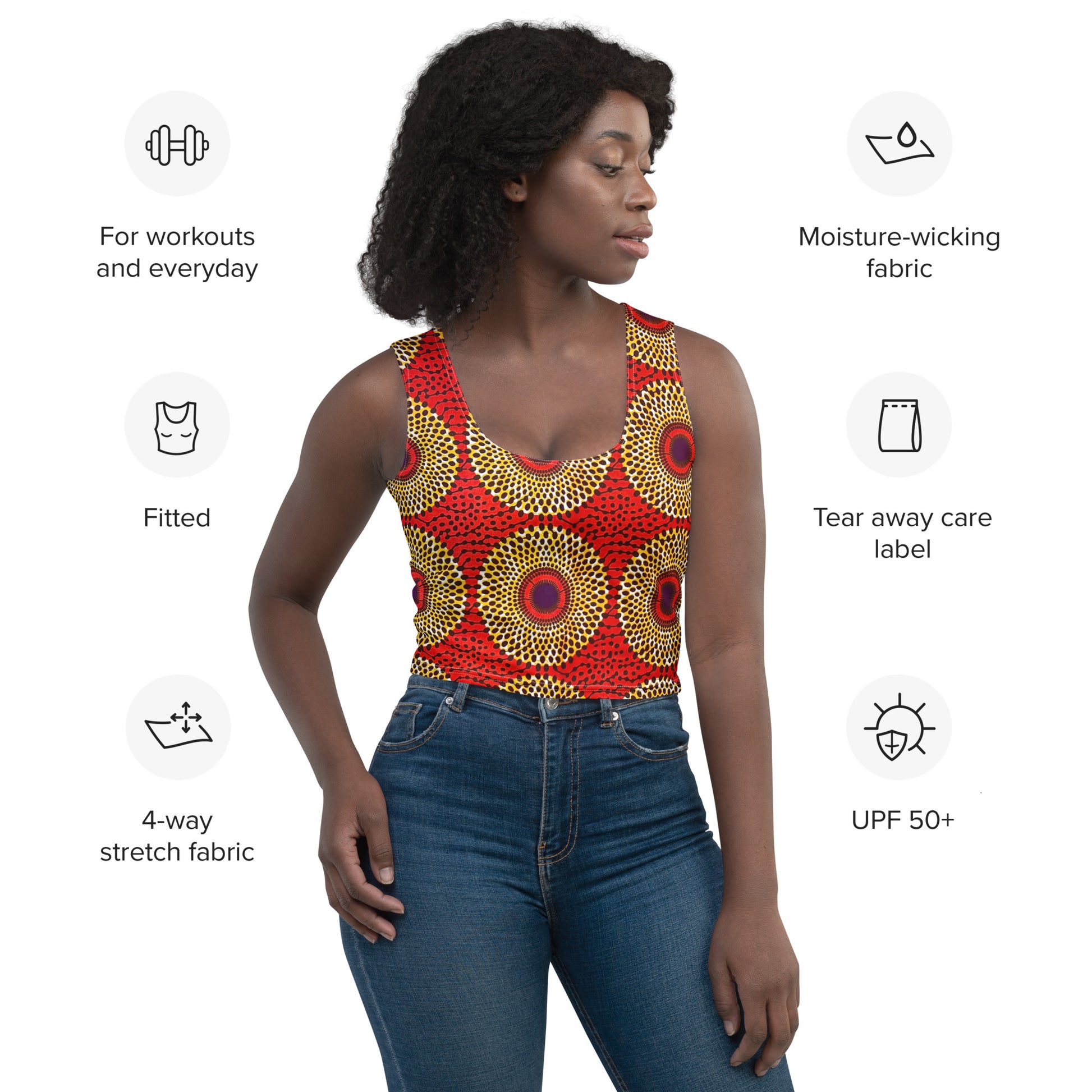 A woman wearing a red and yellow African print crop tank top with a V-neck and sleeveless design. The image also highlights the fabric's moisture-wicking and stretch properties, along with the garment's fit and care instructions.