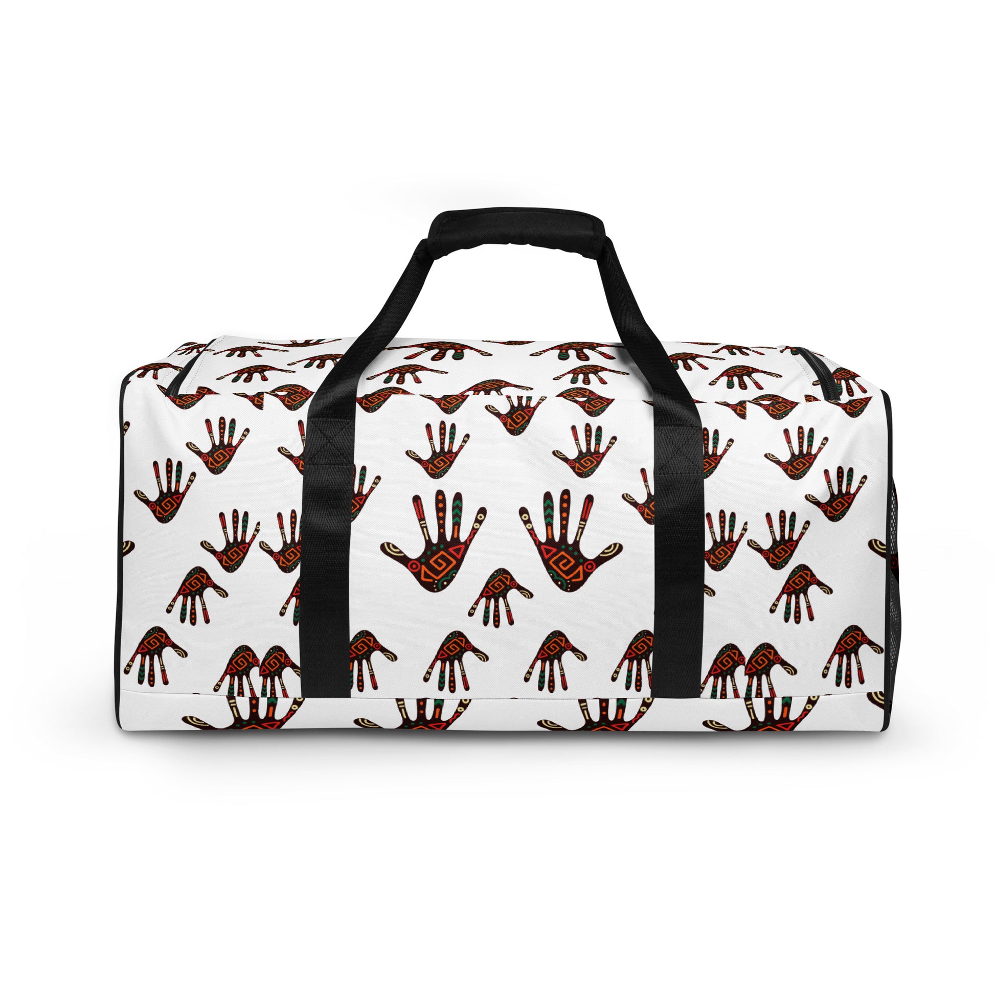 Side view of a white duffle bag, covered with a colorful tribal palm print design, featuring multiple pockets, a black adjustable padded shoulder strap, and dual padded handles.