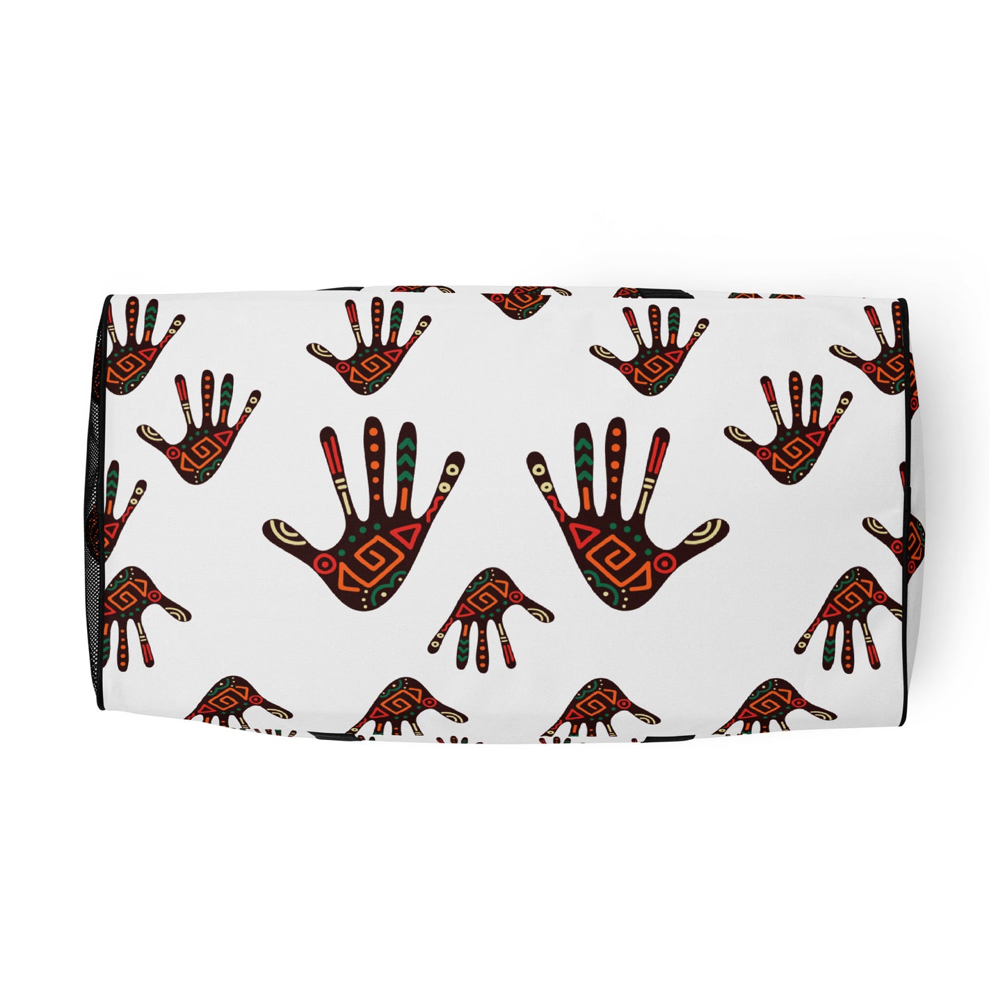 Bottom view of a white duffle bag, covered with a colorful tribal palm print design, featuring multiple pockets, a black adjustable padded shoulder strap, and dual padded handles.