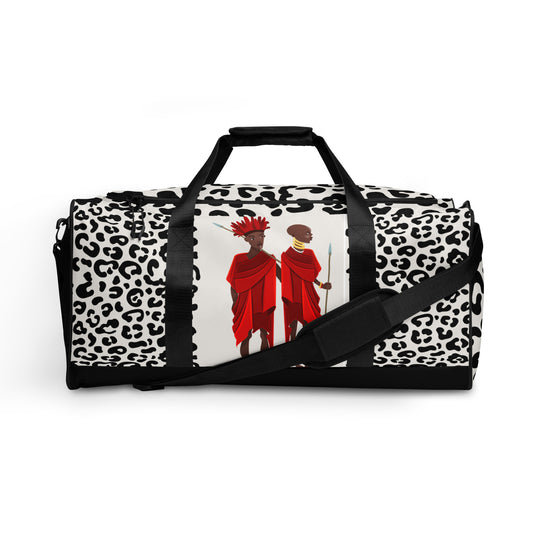  Front view of Agojie Animal Print Duffle Bag showing the dual small carriers strapped up, while the longer single strap is dropped down and across the front of the bag.
