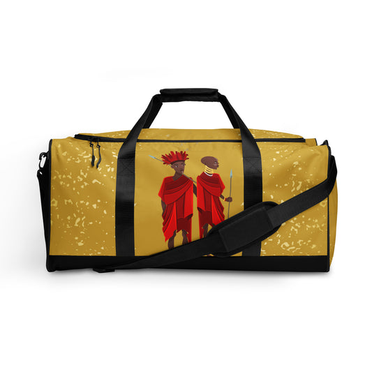 Front view of Agojie Gold Duffle bag showing the dual small carriers strapped up, while the longer single strap is dropped down and across the front of the bag.
