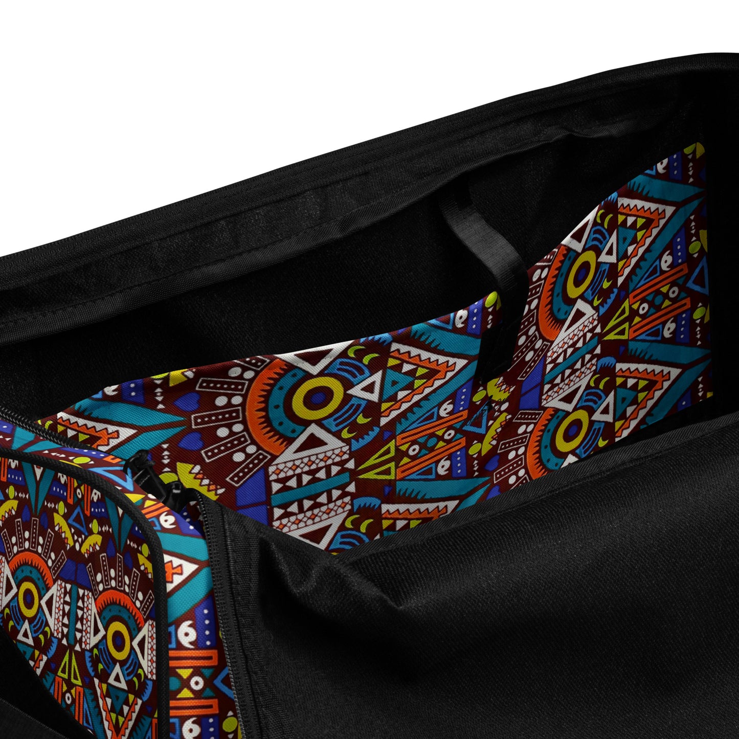 Spacious inside side pocket of Tozi Duffle Bag, clothed in the custom geometric Aztec Print.