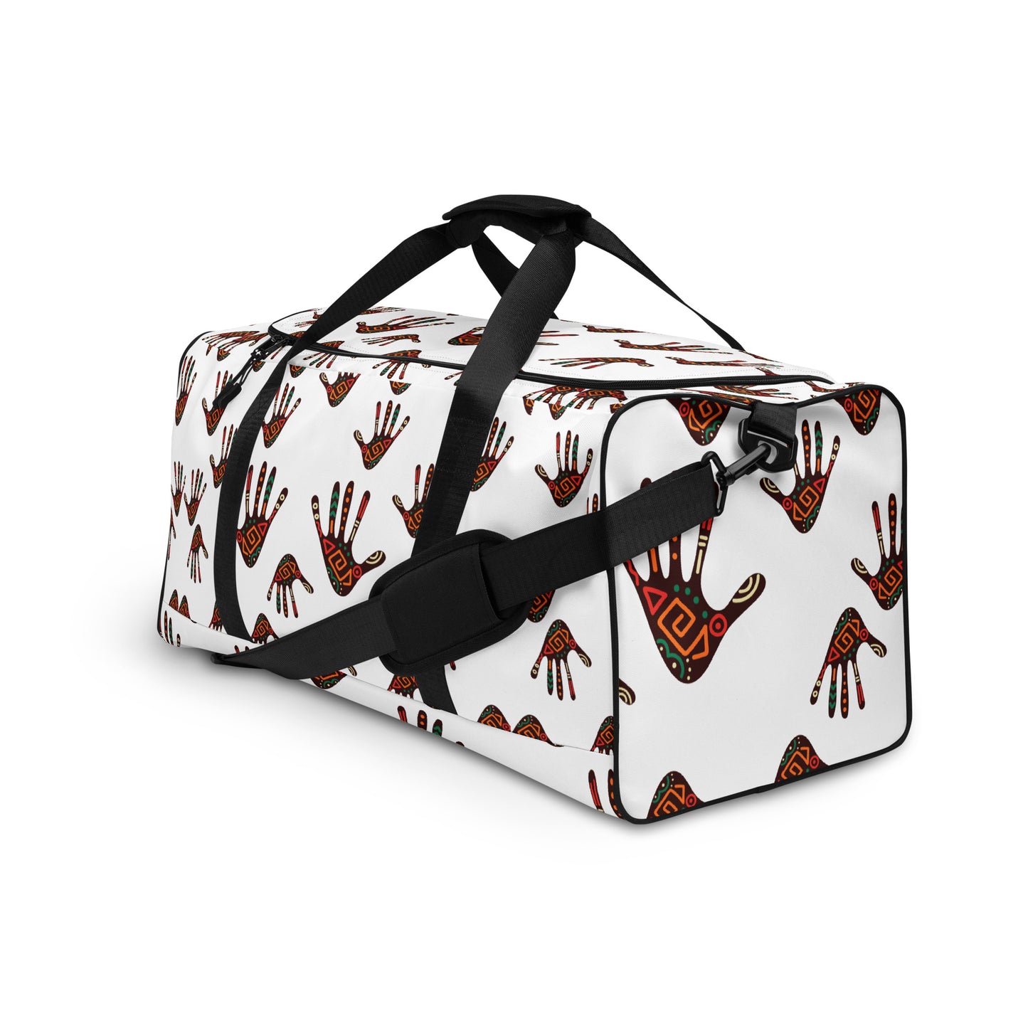 Side view of a white duffle bag, covered with a colorful tribal palm print design, featuring multiple pockets, a black adjustable padded shoulder strap, and dual padded handles.