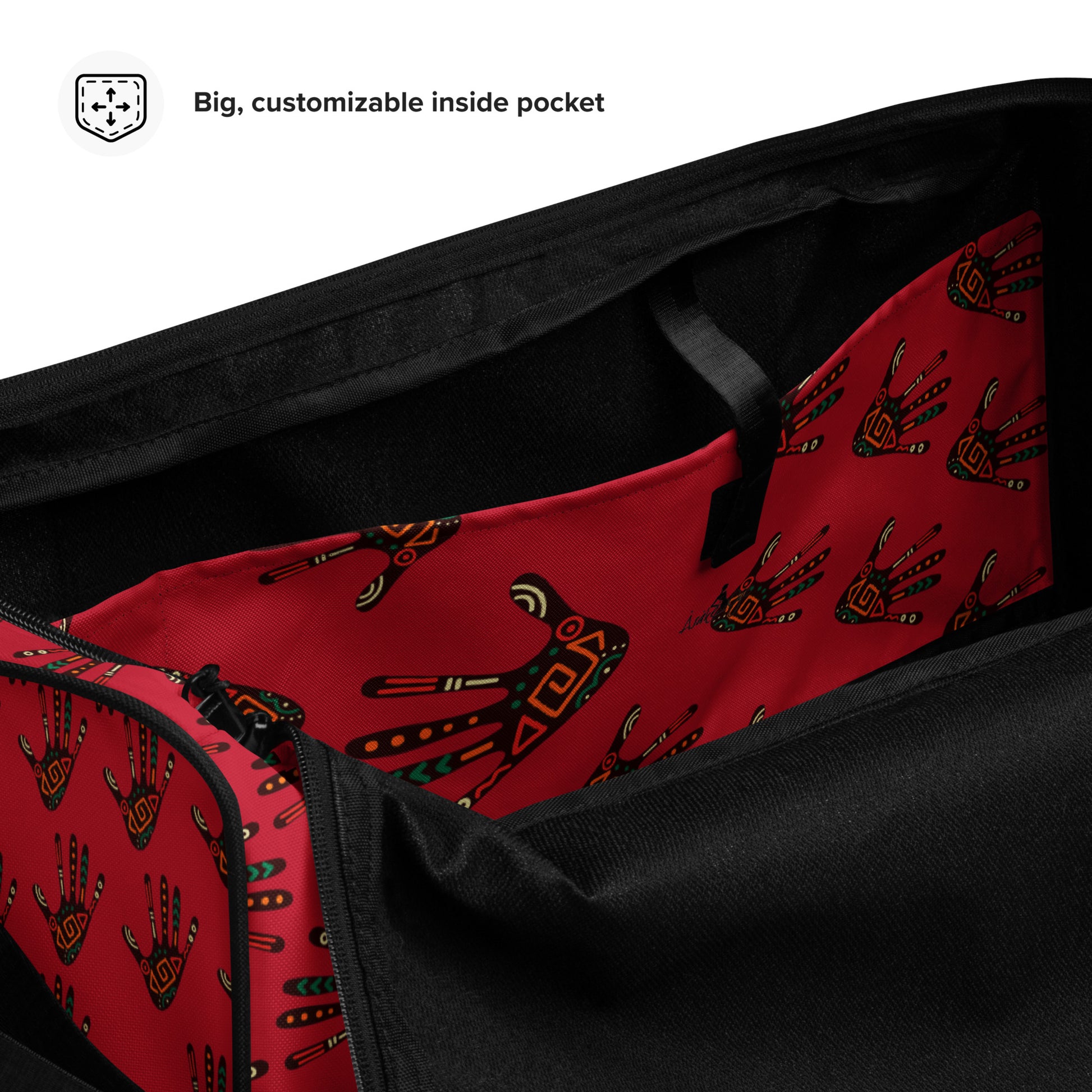 Spacious inside side pocket of Duro Crimson duffle bag; clothed in the custom Tribal Palm Print on red background.