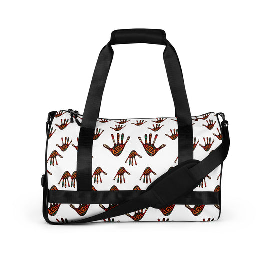Sideview of Duro Overnight Gym Bag showcasing the multicolour tribal palm print design on a white background, padded adjustable black straps, and a black zipper.