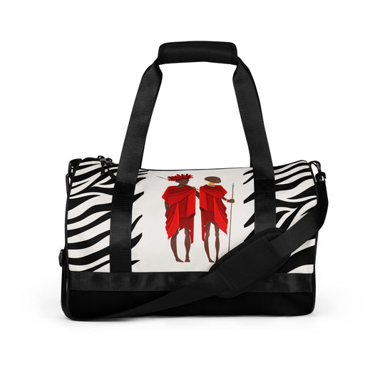 Front view of the black Agojie Zebra print Gym Overnight Bag showcasing the vibrant Zebra print and custom Sahara warriors clothed in red wrappers.