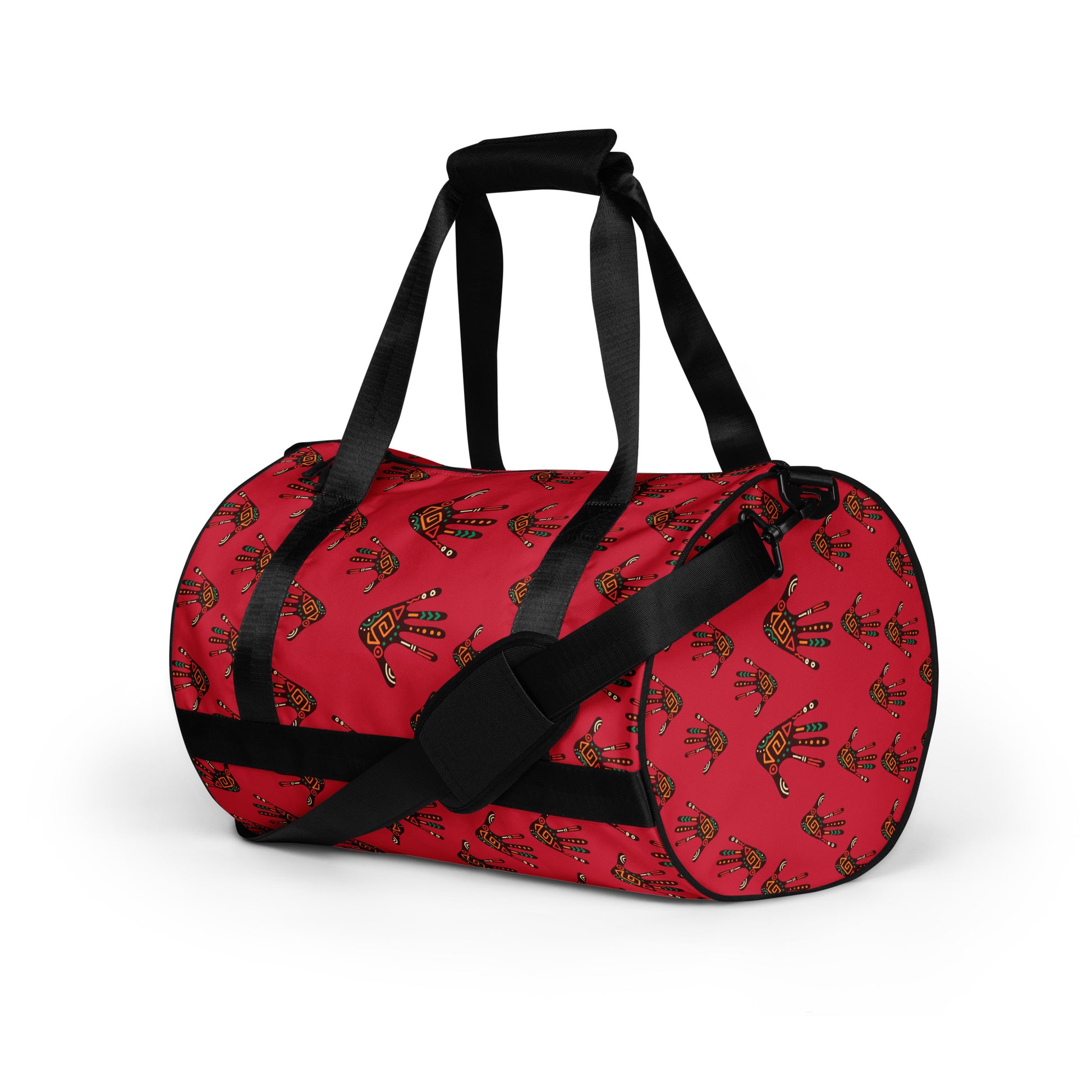  Left front side view of Duro Crimson Tribal Palm Print Overnight Gym Bag showing the dual small carriers strapped up, while the longer single strap is dropped down and along the front of the bag. 
