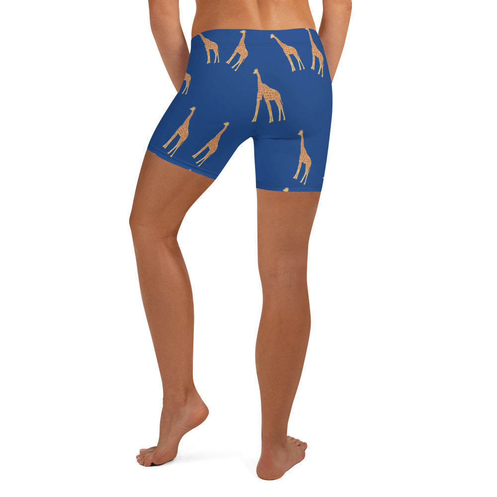 Back view of Twiga Print Shorts highlighting body fitting design and gold giraffe pattern on blue background.