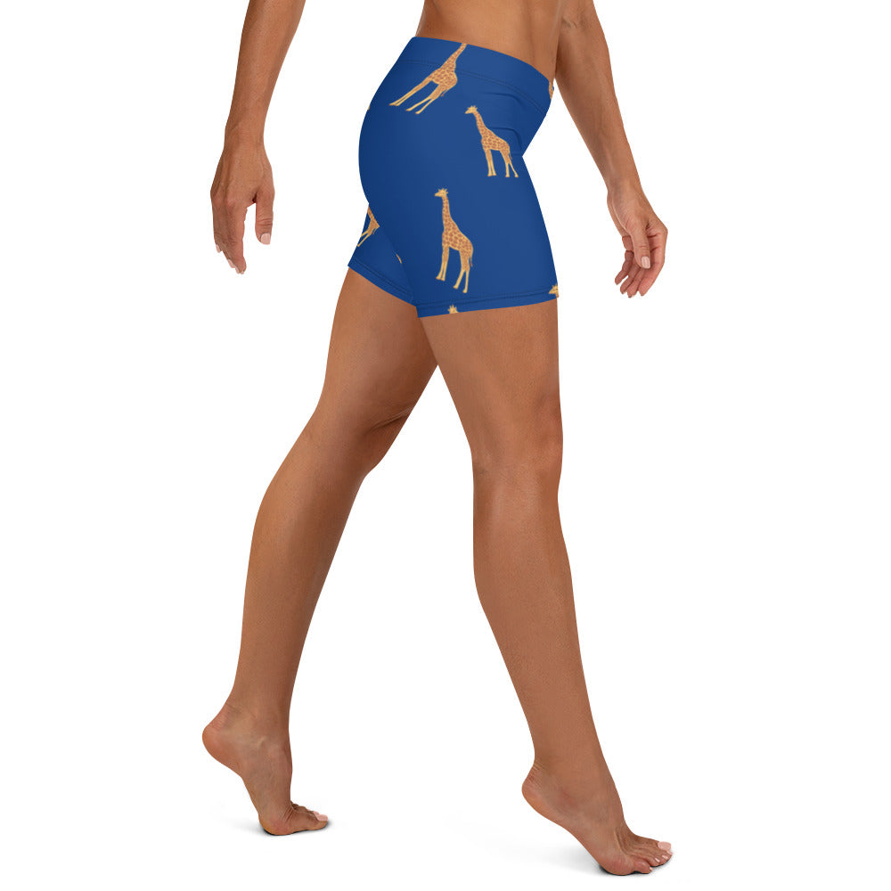Side view of Twiga Print Shorts highlighting body fitting design and gold giraffe pattern on blue background.