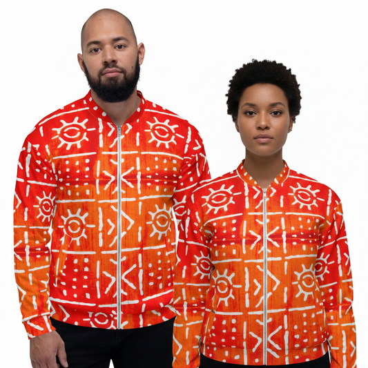 A man and a woman modeling matching orange and red patterned zip-up jackets with white geometric and sun motifs, set against a plain white background.