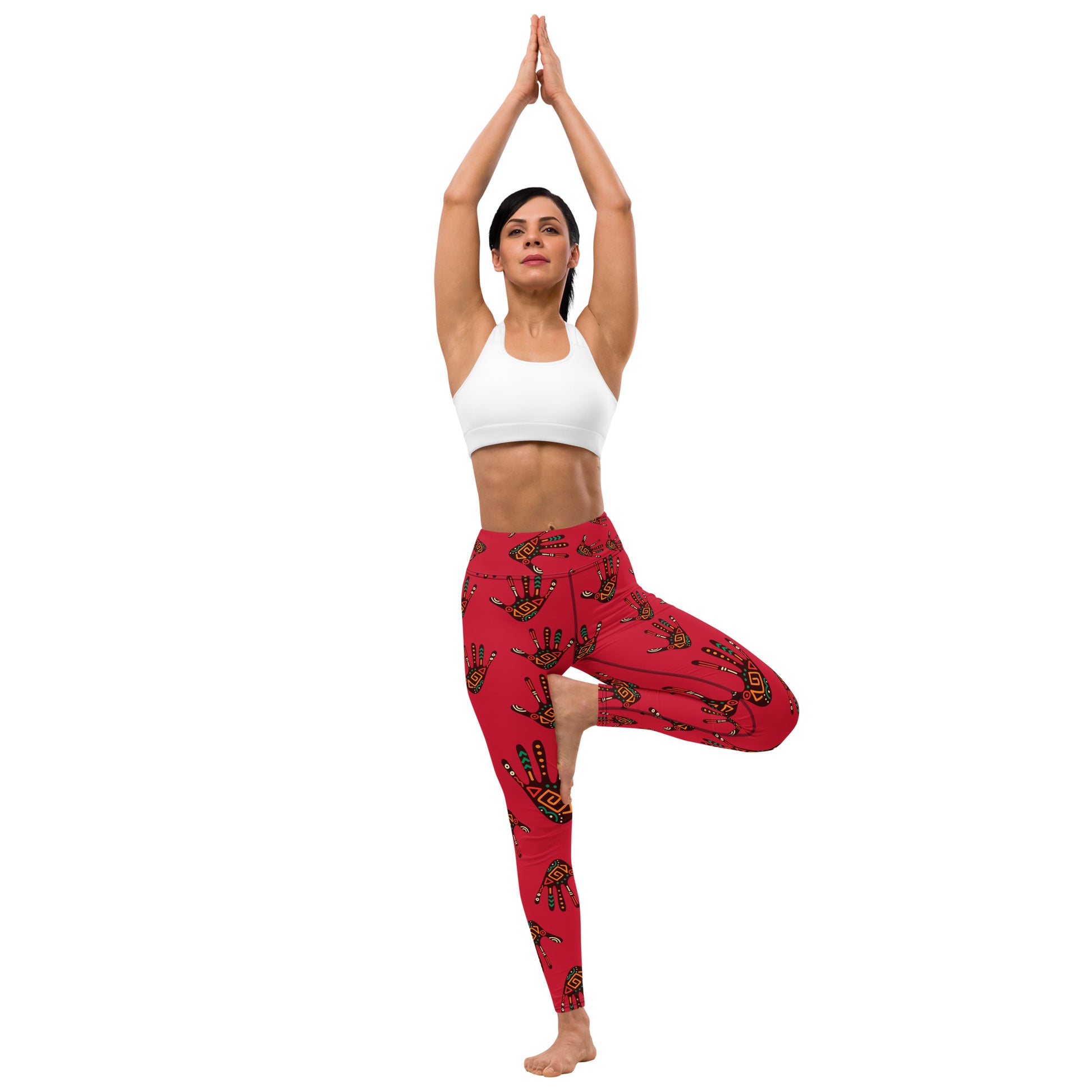 Front view of woman standing; wearing Duro Crimson Tribal Palm Print Leggings and doing a yoga pose