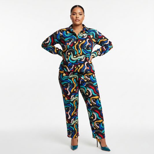 Woman wearing a colorful patterned outfit on a white background