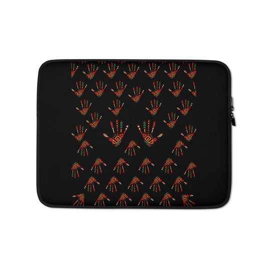 A 13 inch black laptop sleeve with a vibrant, tribal palm print design featuring brown, red, orange, green, and cream colours.