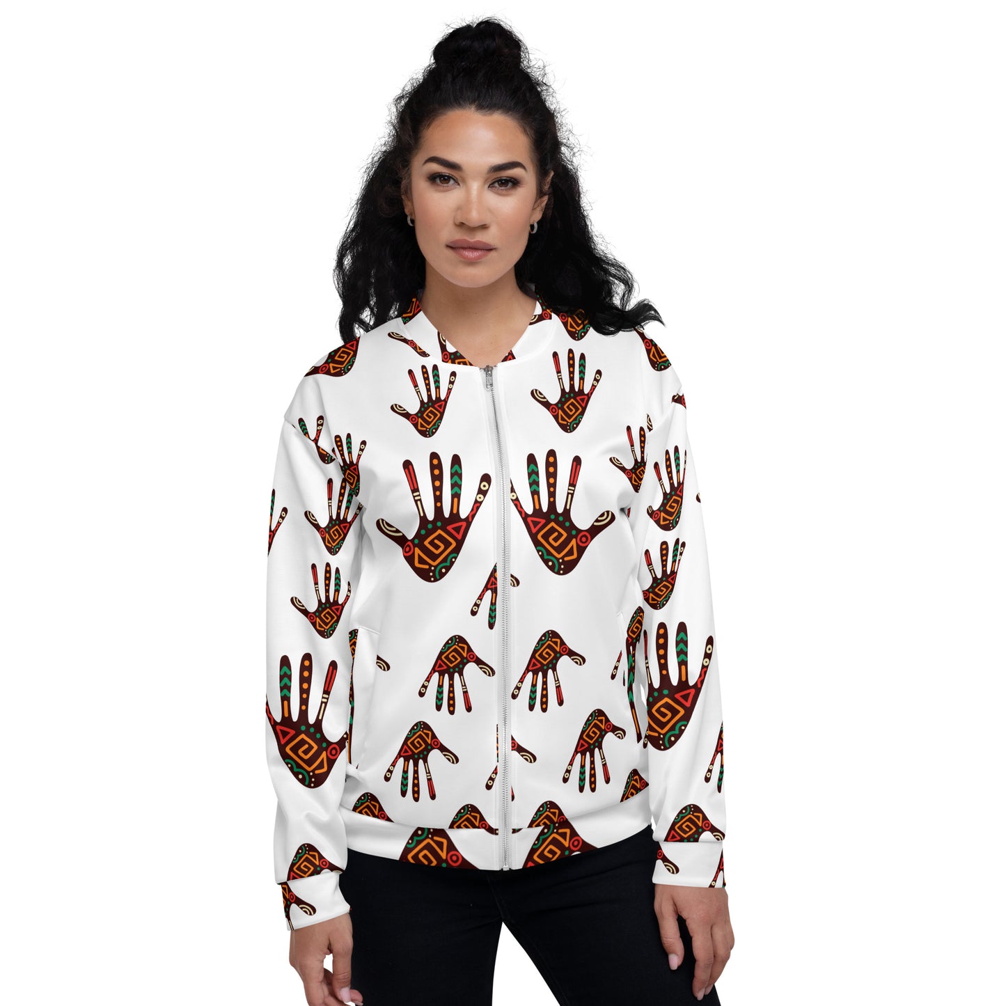 A woman wearing a white unisex bomber jacket with a colorful geometric pattern.