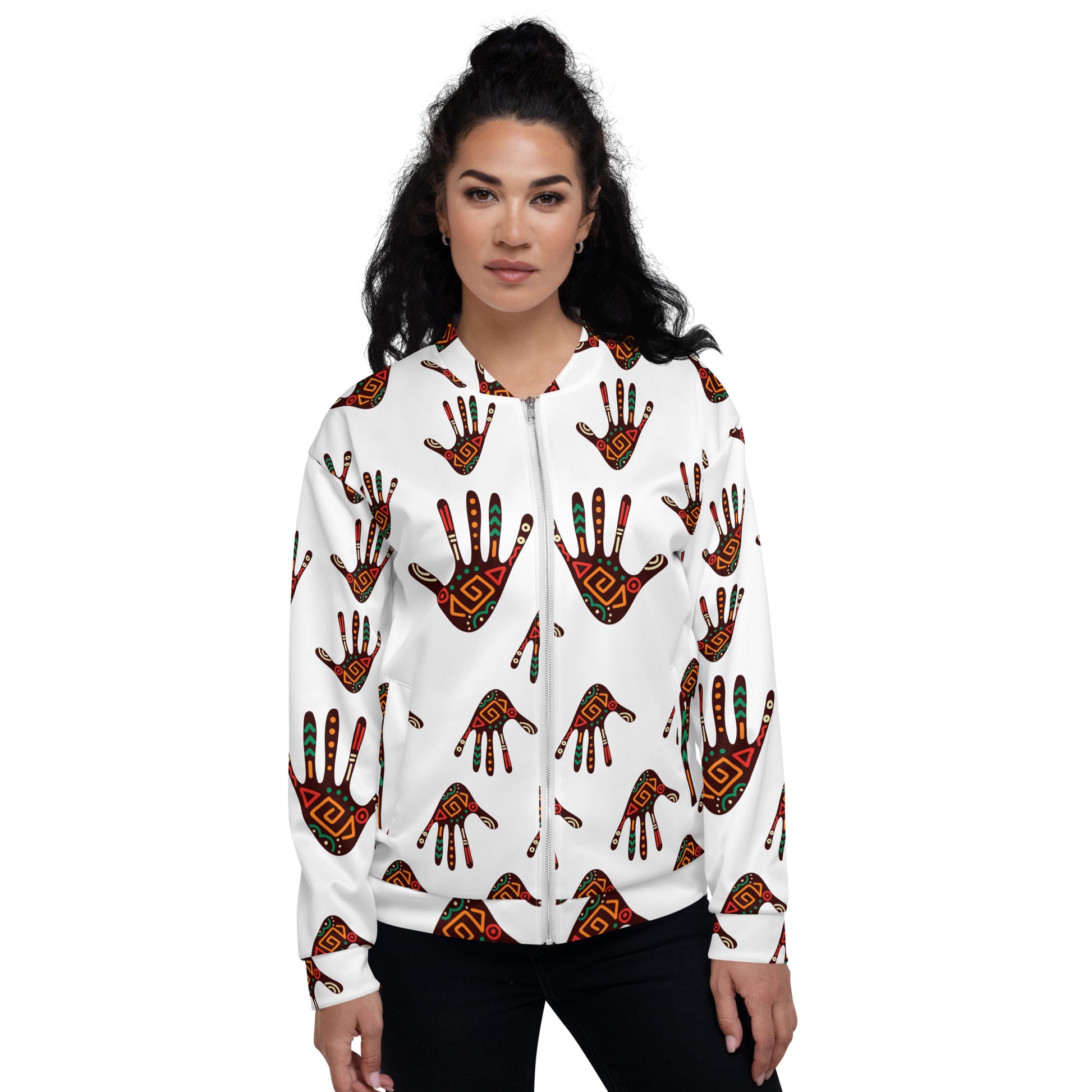 A woman wearing a white unisex bomber jacket with a colorful geometric pattern.