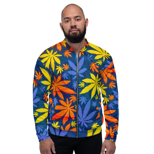 A man wearing a colorful African Print Unisex Bomber Jacket — Mari | ASAKE-OGE with a marijuana leaf pattern. The jacket is primarily blue with yellow and orange accents.