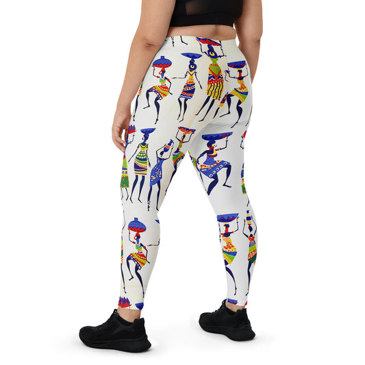 Back view of curvy woman wearing sneakers and Yeye leggings; showcasing a close up view of the colorful depiction of African women dancing and carrying calabashes and jars