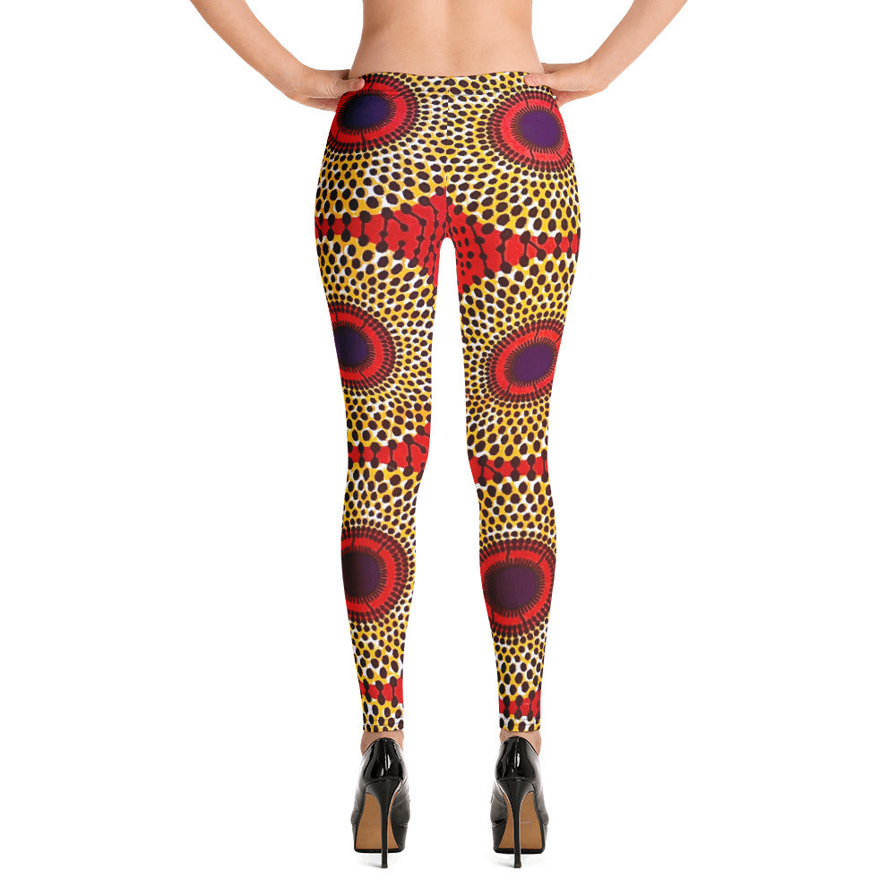 Back view of woman wearing vibrant colored, geometric-pattern Rekiana African print athleisure sport yoga leggings