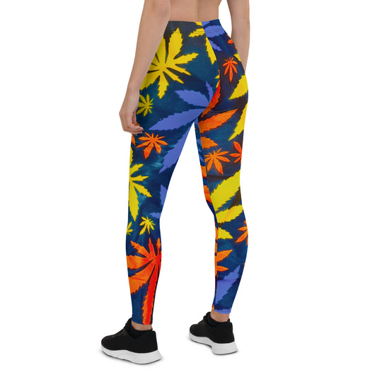 Back view of Mari Workout Yoga Leggings; detailing the mid-waist fit and vibrant, multicolored cannabis leaf pattern. These leggings are crafted from a blend of polyester and spandex, offering a four-way stretch for enhanced mobility and comfort.