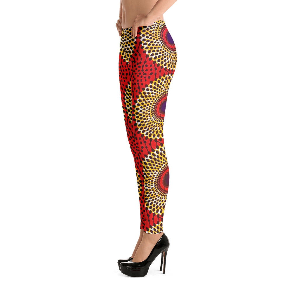 Side view of woman wearing vibrant colored, geometric-pattern Rekiana African print casual wear yoga leggings