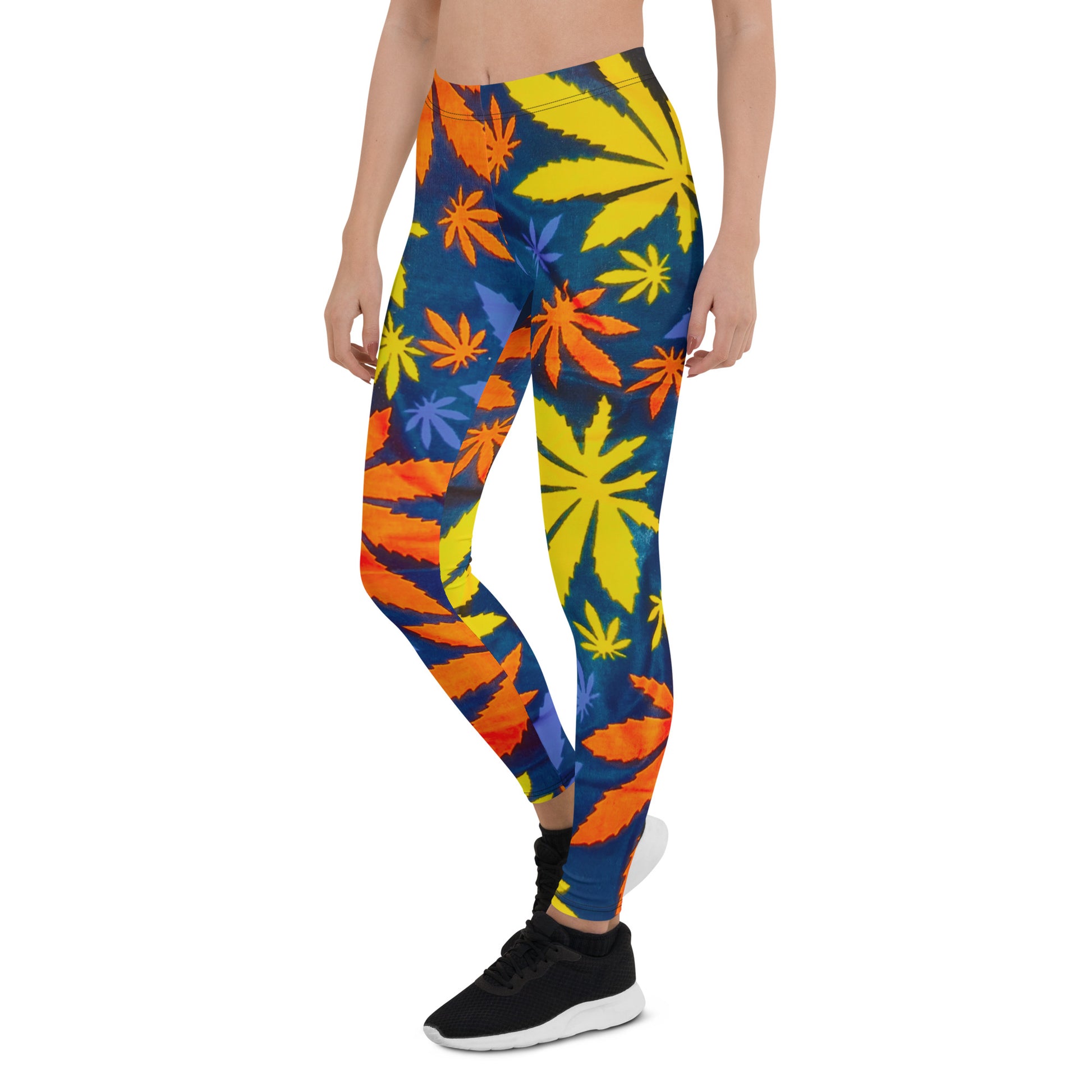 Frontal side view of woman wearing sneakers and Mari Yoga Leggings