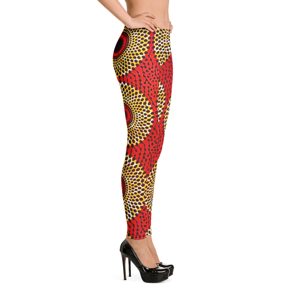 Side view of woman in heels wearing vibrant colored, geometric-pattern Rekiana African print leggings