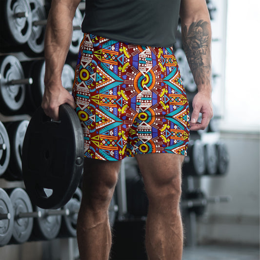 A man wearing athletic shorts with a colorful Aztec print design.