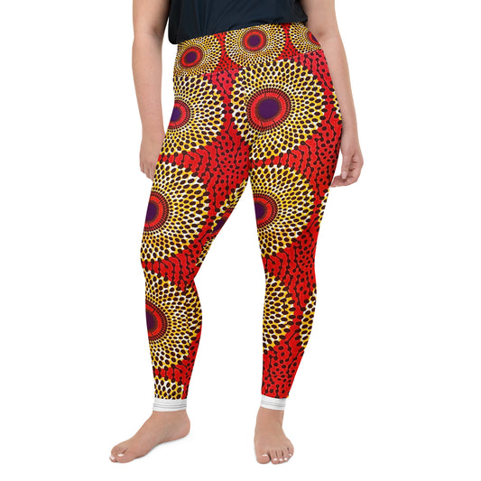 Front view of woman wearing vibrant colored, geometric-pattern Rekiana Ankara print plus size leggins