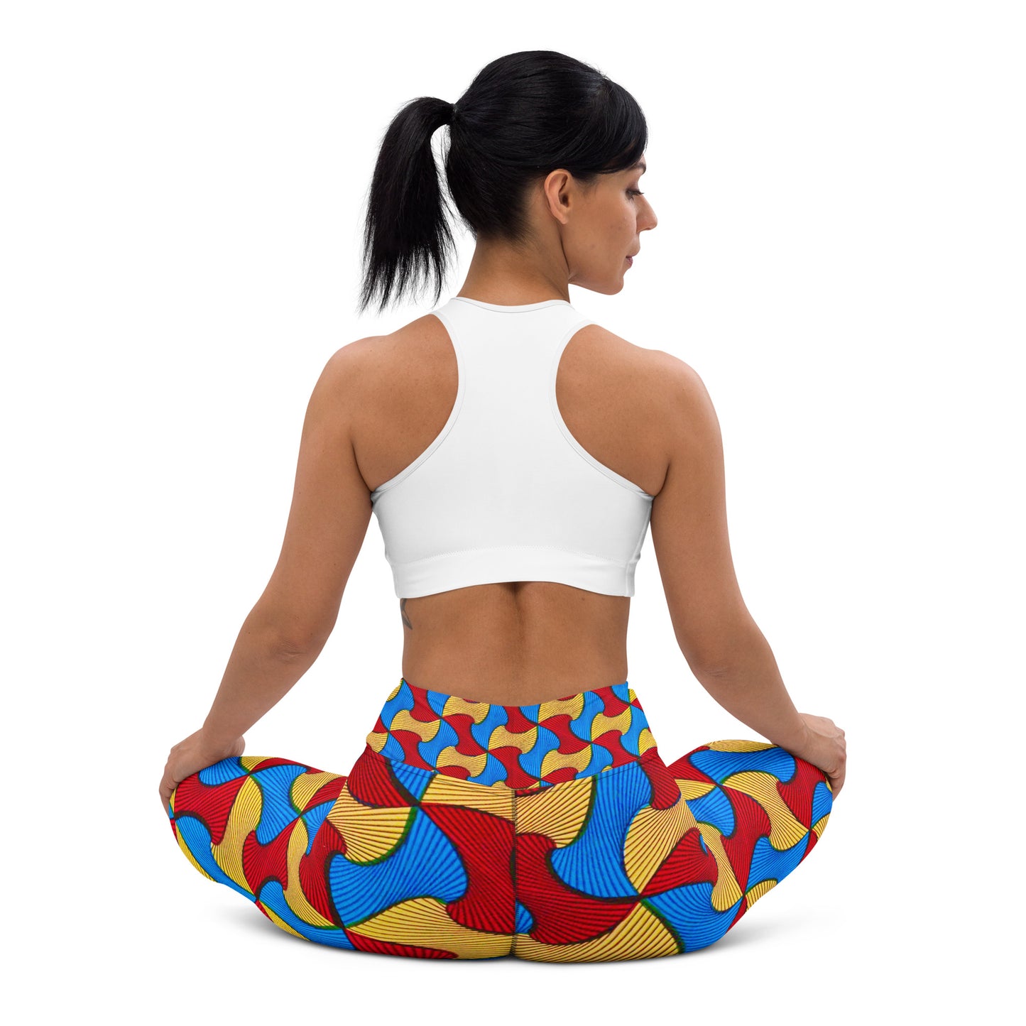 Back view of woman sitting in a yoga pose; wearing Santi Ankara Print Leggings