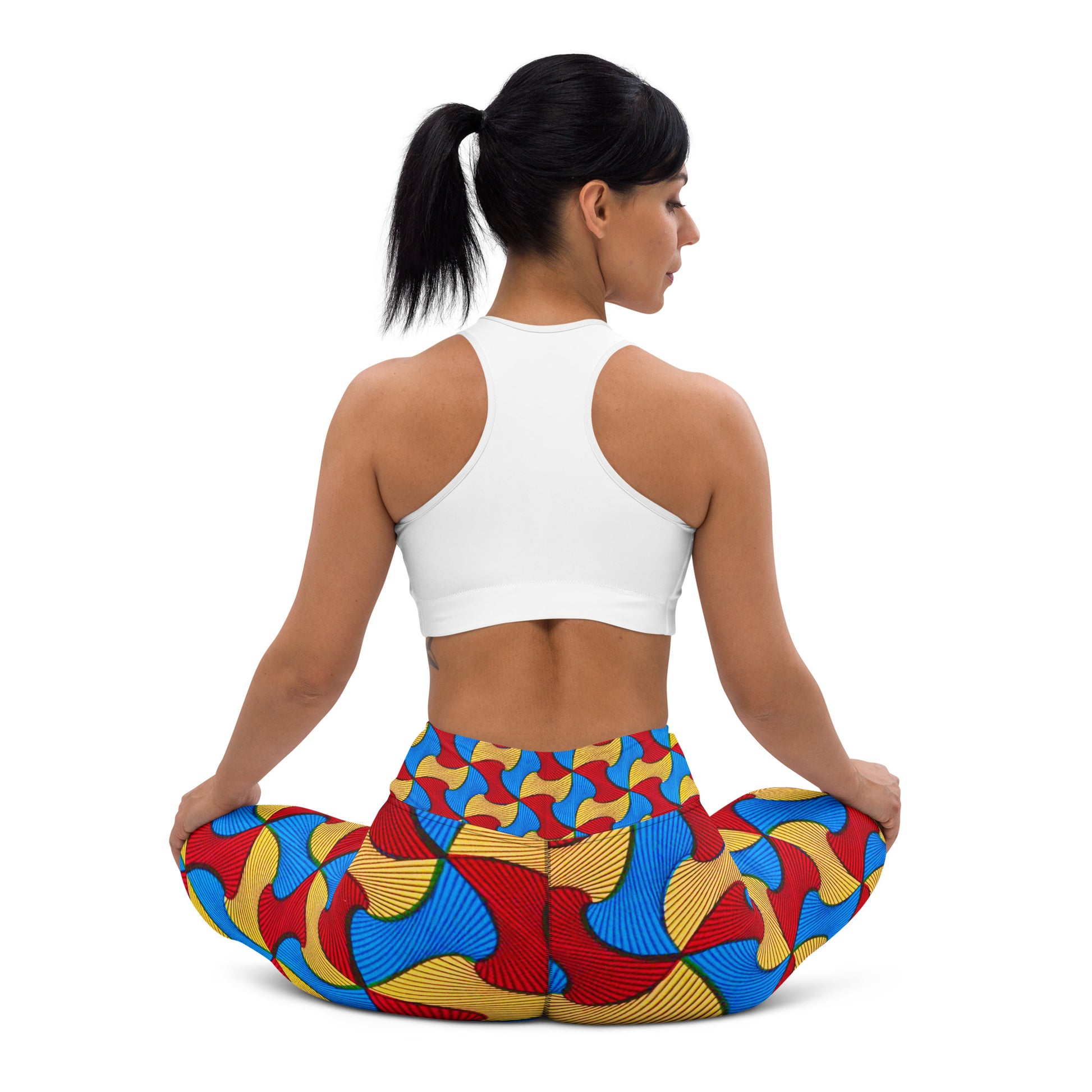 Back view of woman sitting in a yoga pose; wearing Santi Ankara Print Leggings
