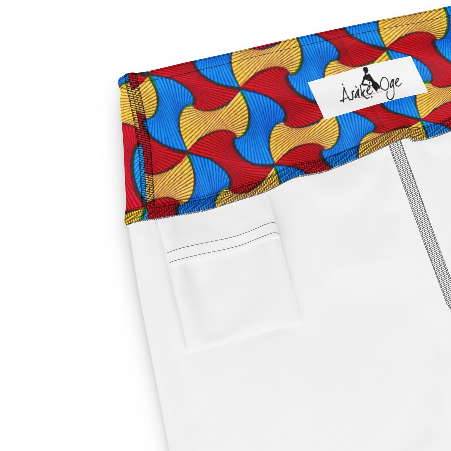 Inside waistband of Santi Ankara Print Yoga Workout Leggings; showing the Asake Oge logo