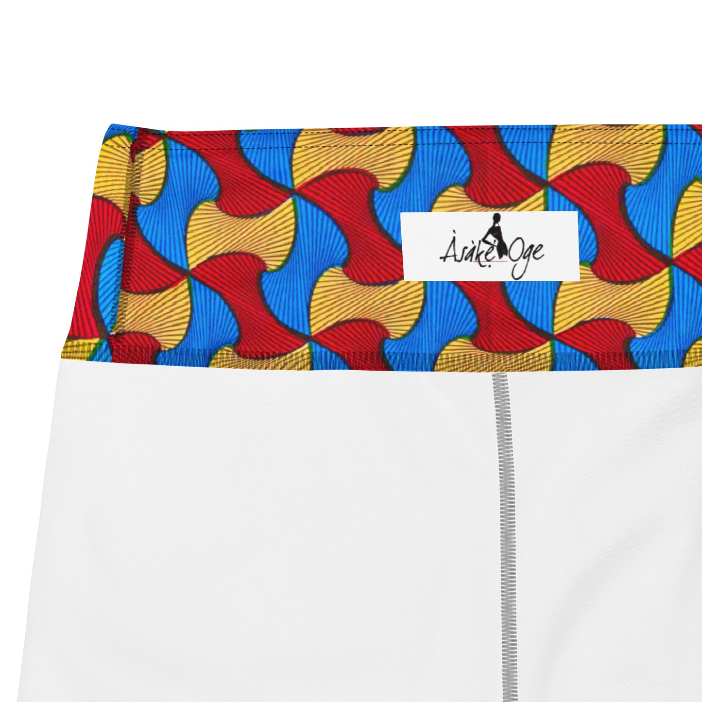 Inside waistband of Santi Ankara Print Yoga Workout Leggings; showing the Asake Oge logo